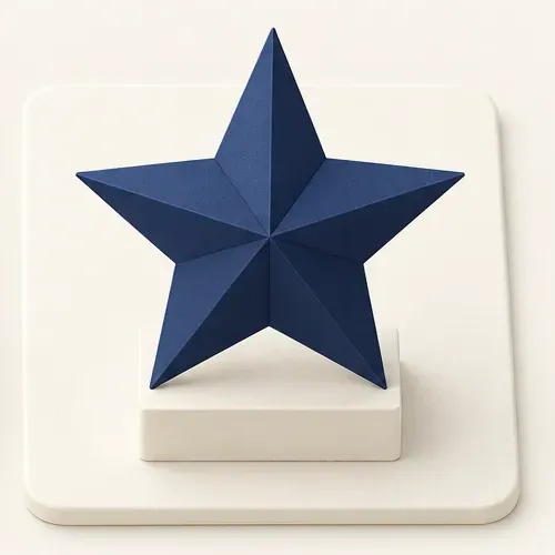 A folded navy paper star on a small ivory pedestal.
