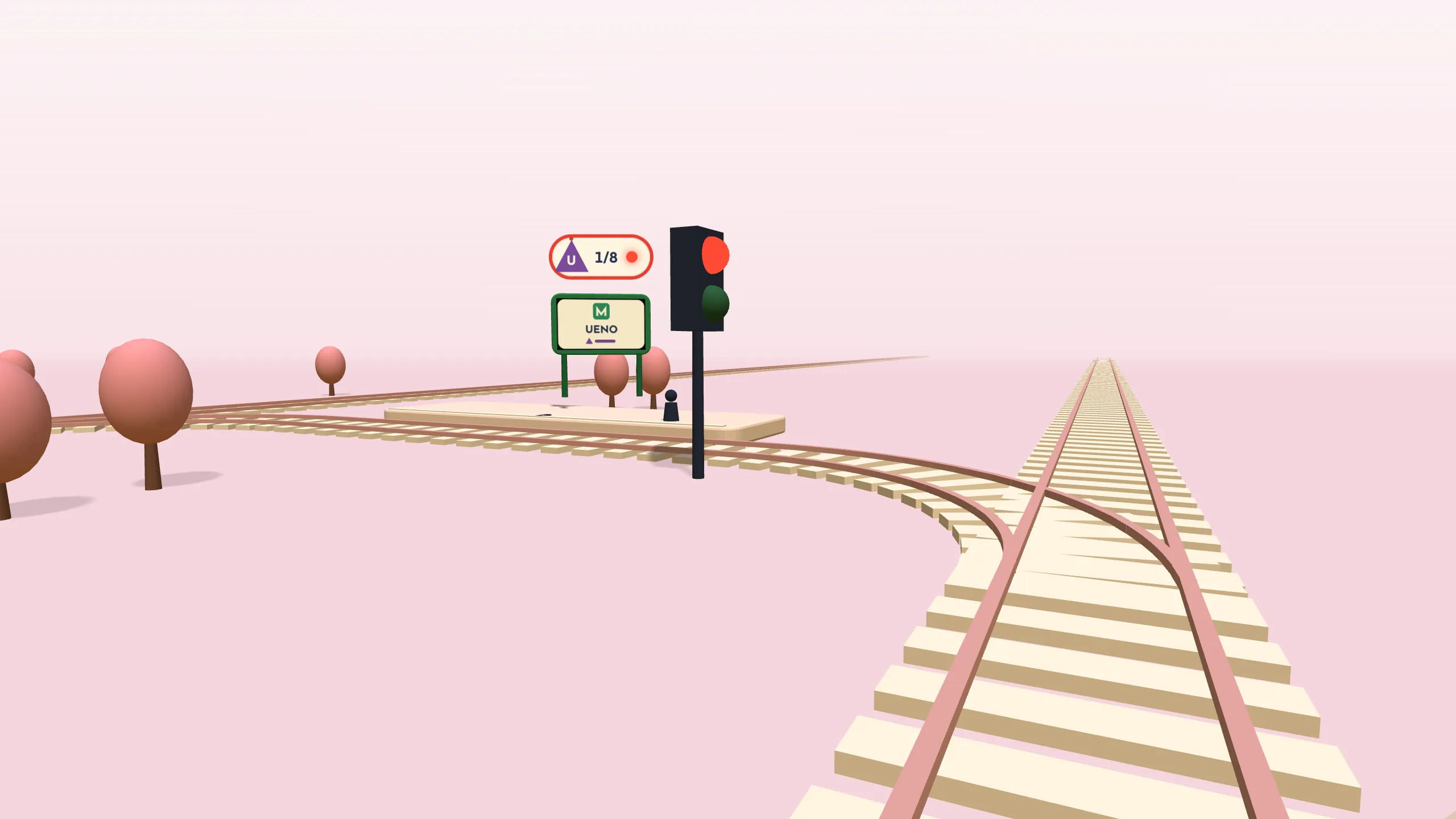 The view from the driver’s cab: track curving towards a platform, with a red signal ahead.